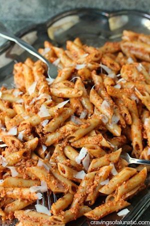 Penne with Sun Dried Tomato Pesto served on a silver platter 