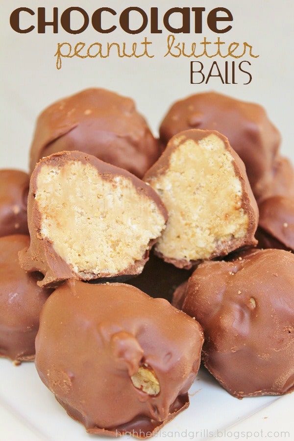 Plate of Chocolate Peanut Butter Balls with one ball cut in half, showing the insides with the rice krispy, peanut butter filling.