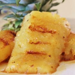 Slices of Grilled Pineapple on a plate.