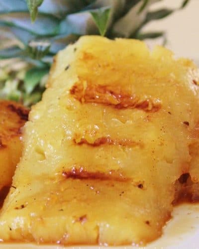 Slices of Grilled Pineapple on a plate.