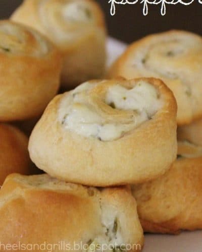 Pile of jalapeno cream cheese roll ups on a plate.