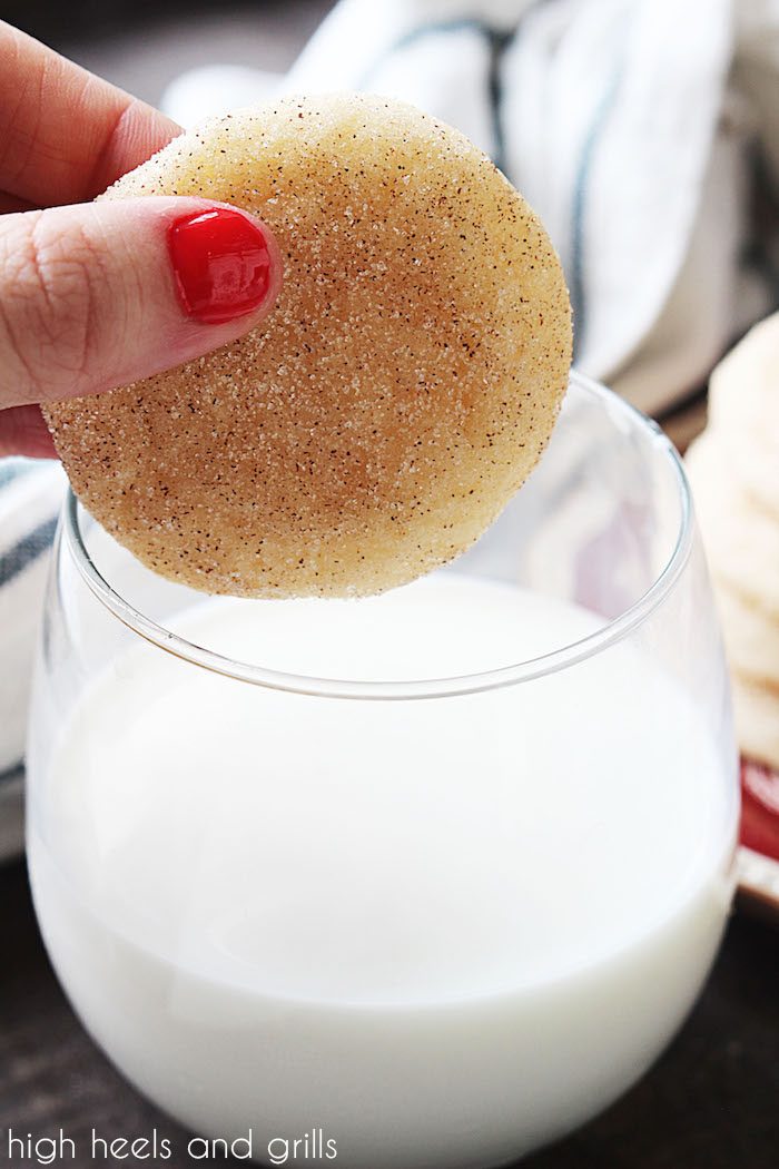 Cookie from the Best Snickerdoodles Recipe ever being dipped into a cup of milk.