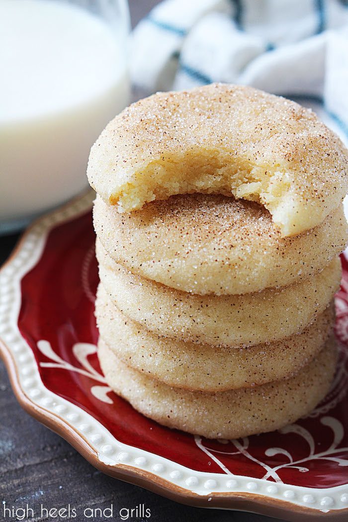 Stack of the Best Snickerdoodles Recipe cookies on a plate with a bite taken out of the top one.