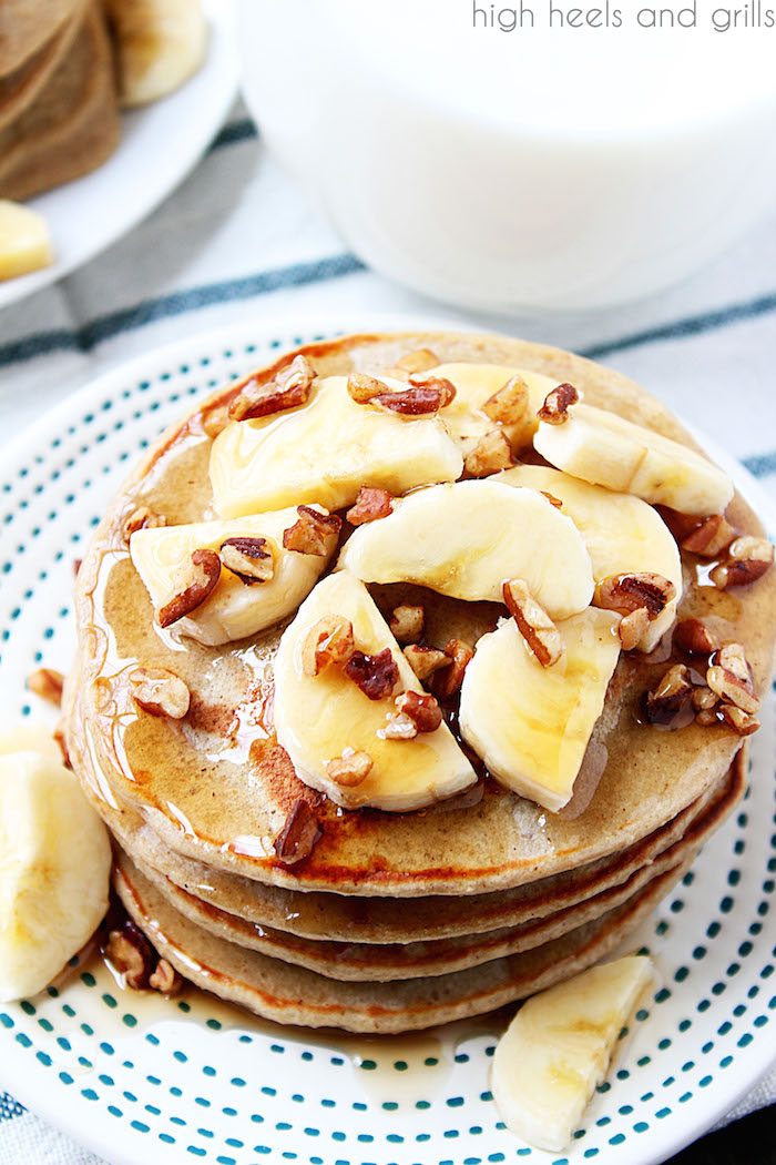 Healthy Banana Pancakes - top view of stack with bananas and pecans on top.