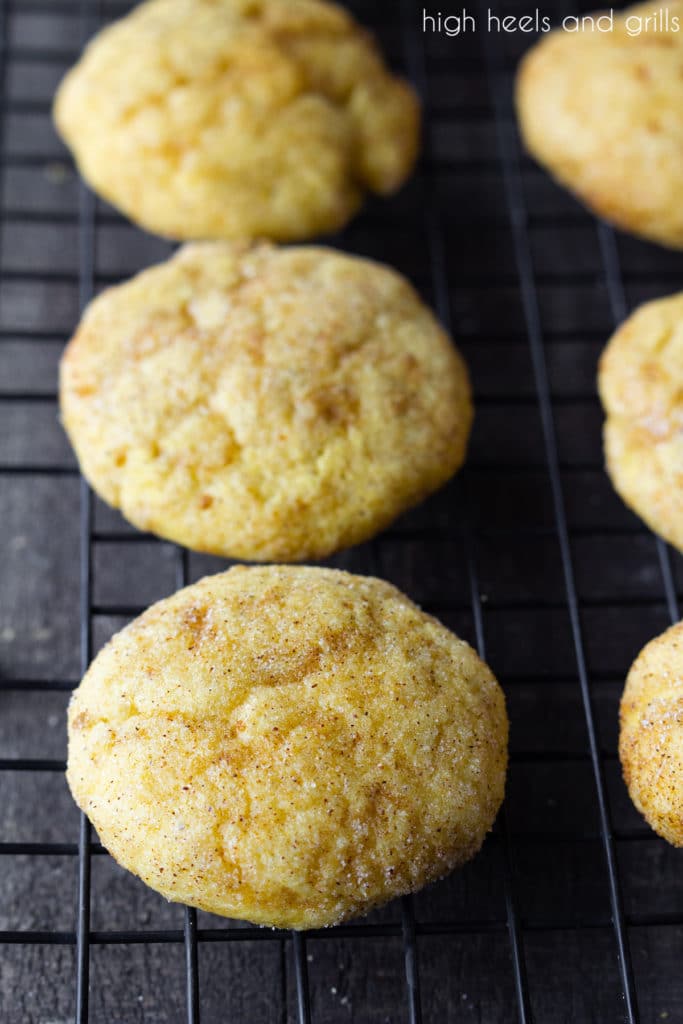 Pumpkin Snickerdoodles sitting on a cooling rack.