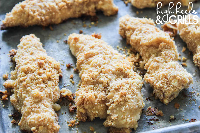 Baked Ritz Garlic Parmesan Chicken Strips - Dipped in yogurt, smothered in Ritz cracker crumbs mixed with garlic salt and parmesan, and drizzled over with butter. Yummy and easy dinner recipe! https://www.highheelsandgrills.com/baked-ritz-garlic-parmesan-chicken-strips-recipe