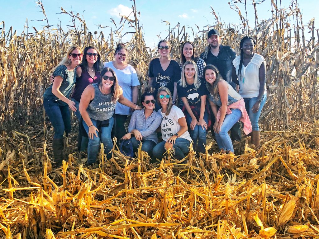 Food bloggers in a field of corn in Iowa