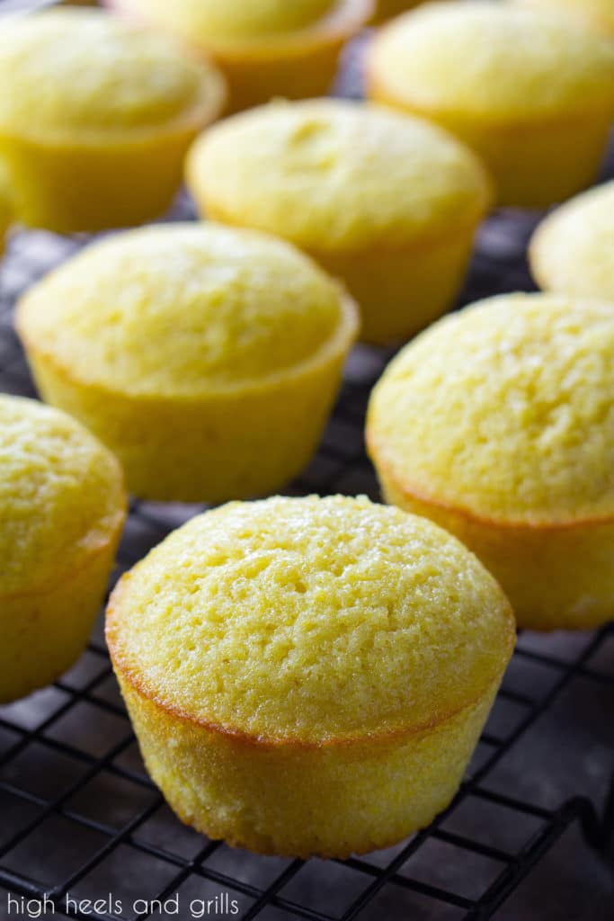 Sweet cornbread muffins cooling on a cooling rack.