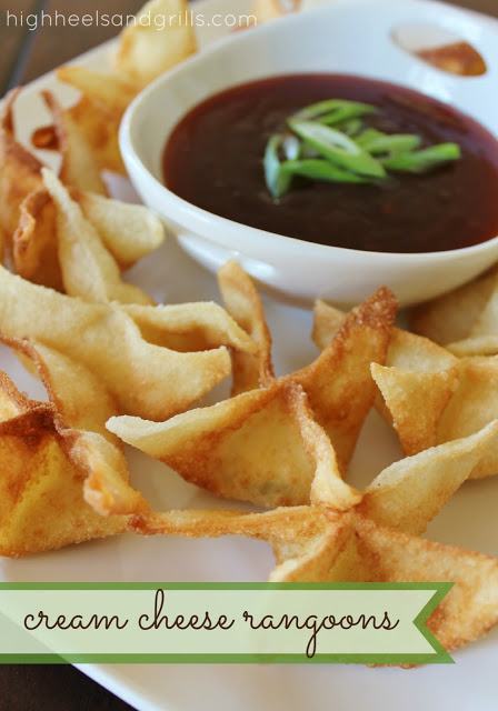 Plate of Cream Cheese Rangoons with a bowl of dipping sauce